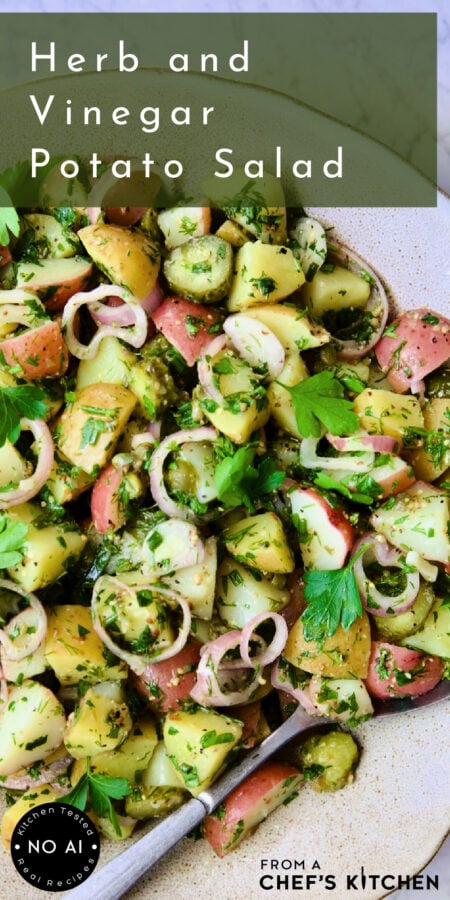 Pinterest graphic for Herb and Vinegar Potato Salad showing it in an earthenware bowl with serving spoon.