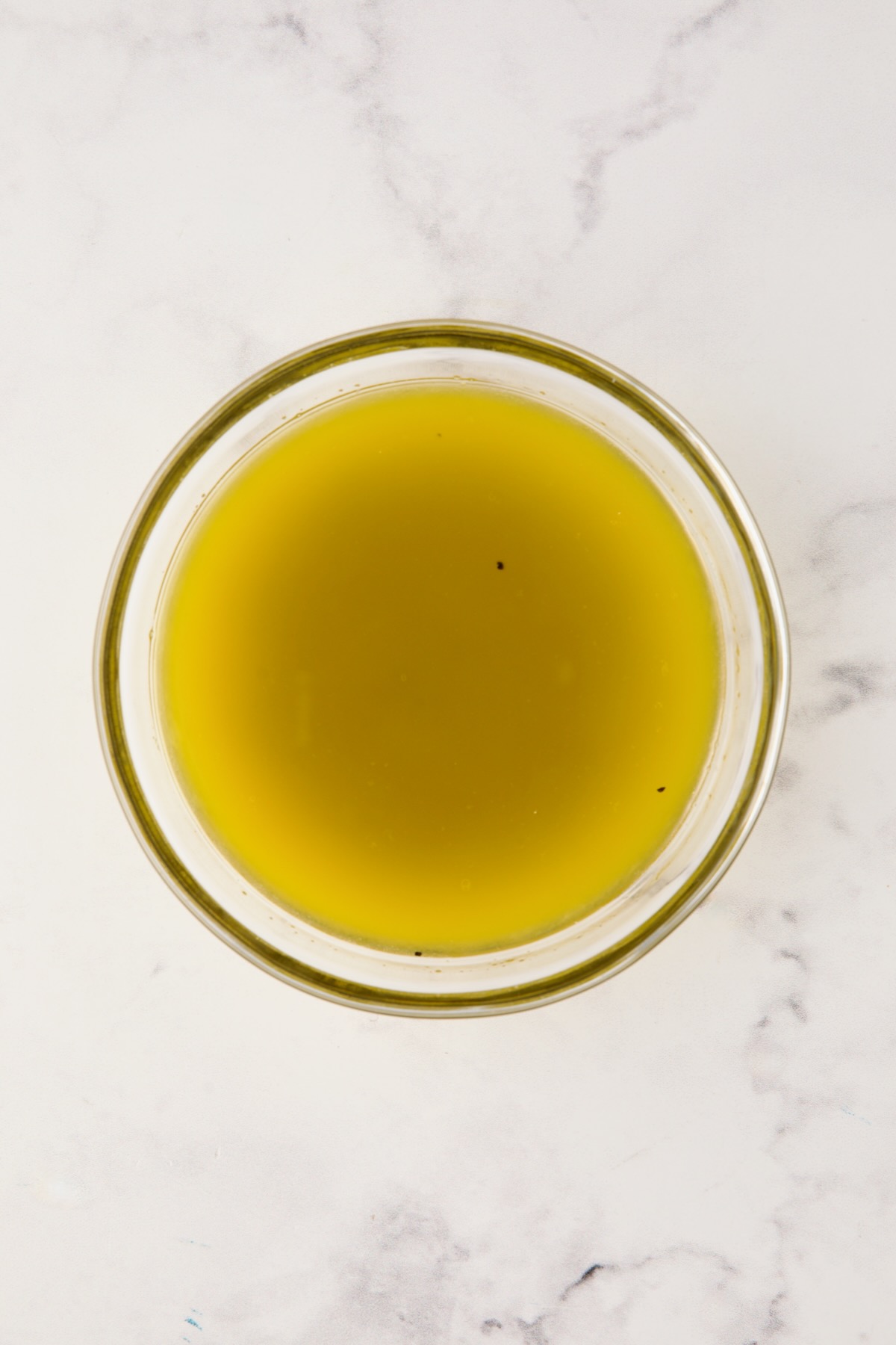 Vinaigrette for potato salad in glass bowl.