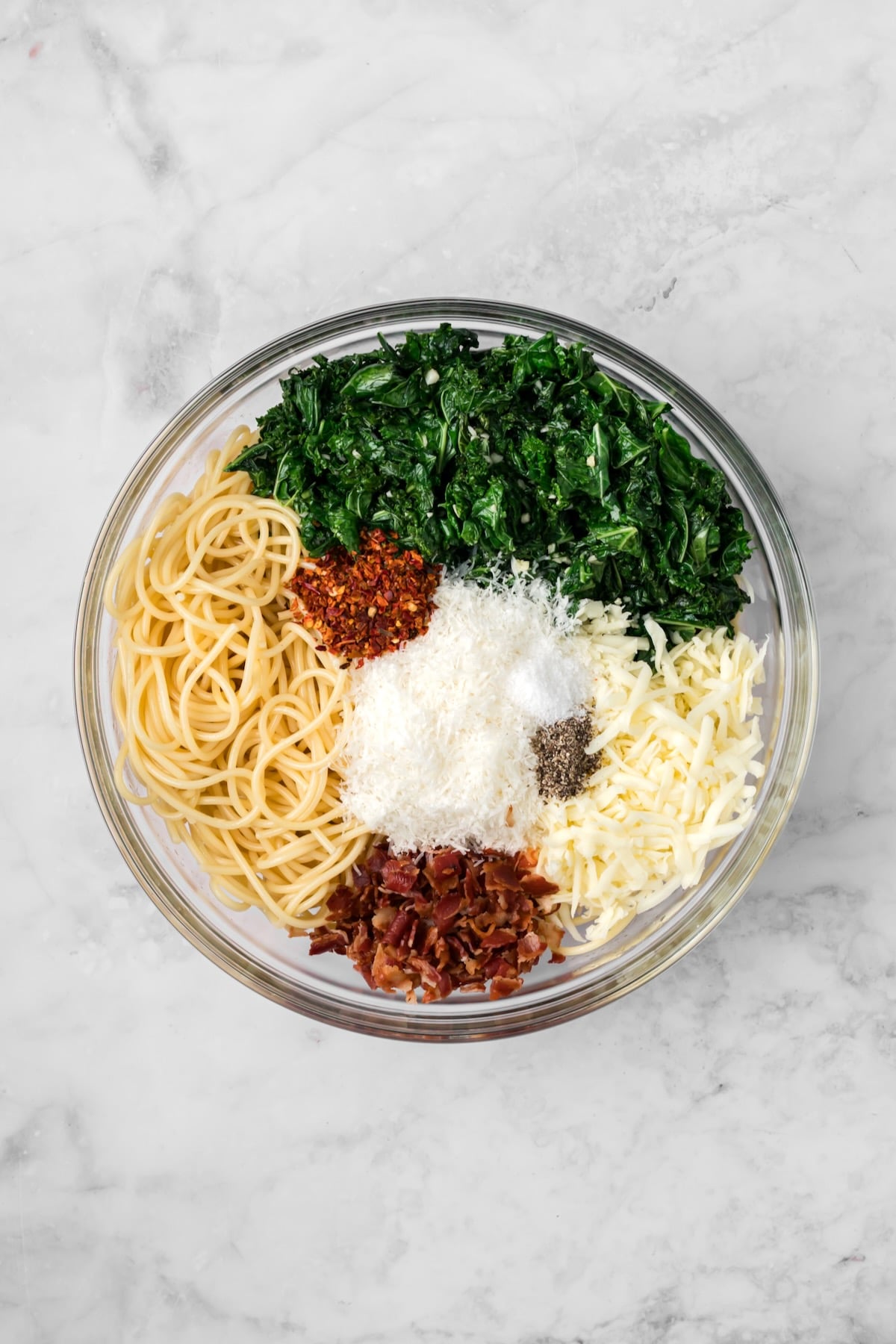 Ingredients for Pasta Frittata in glass bowl before being mixed together.