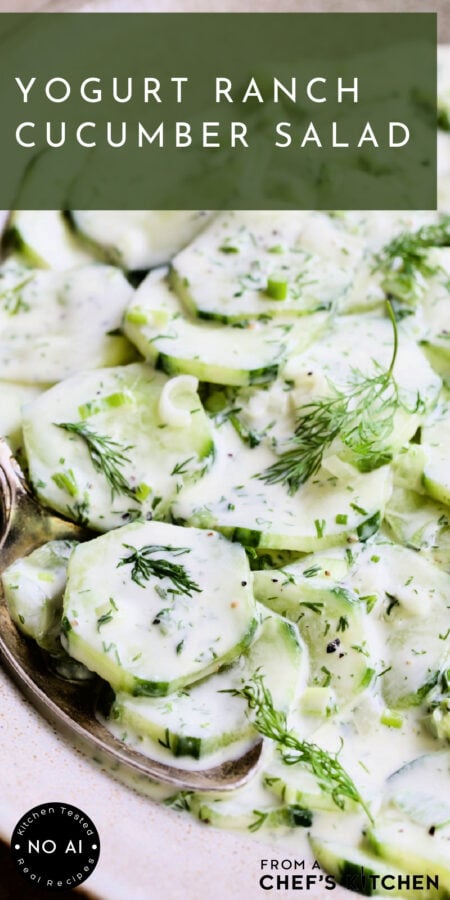 Pinterest graphic for Yogurt Ranch Cucumber Salad showing it close up with serving spoon garnished with fresh dill.