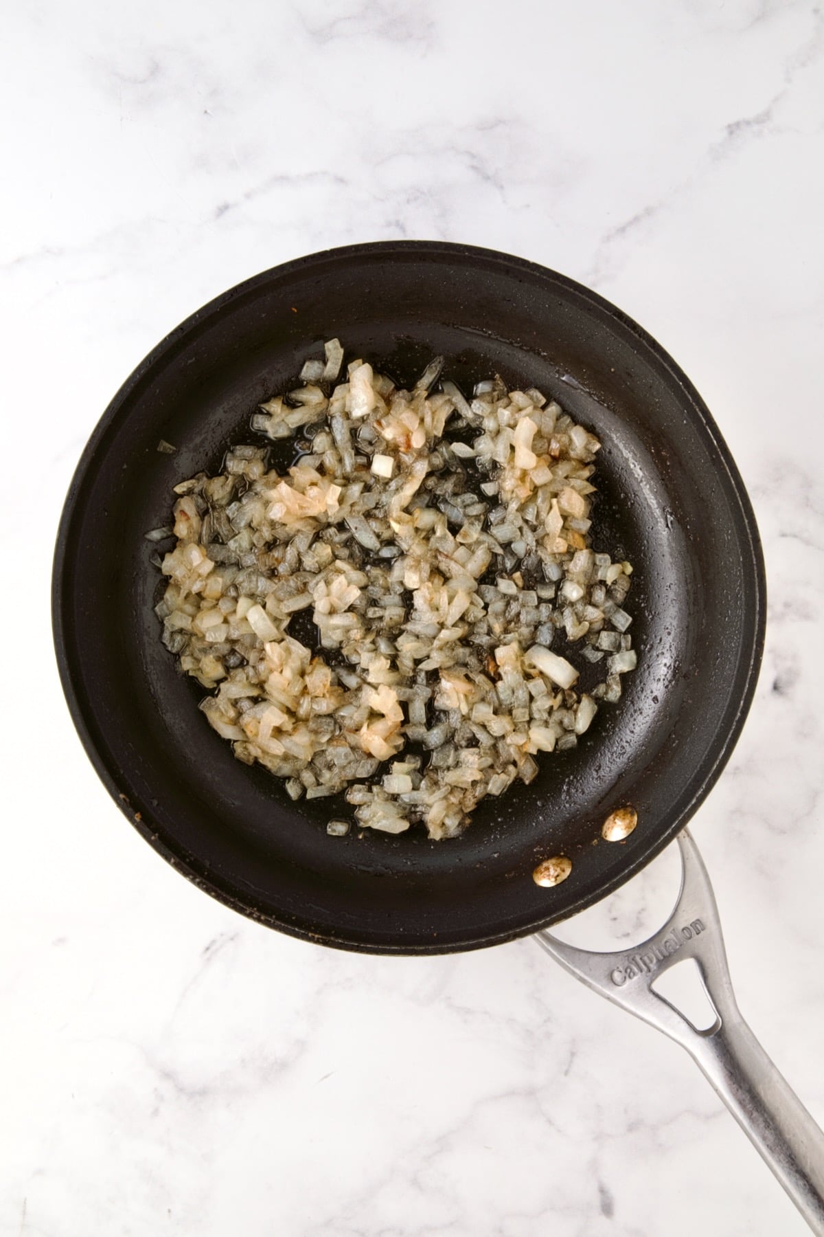 Cooked onion in nonstick skillet.