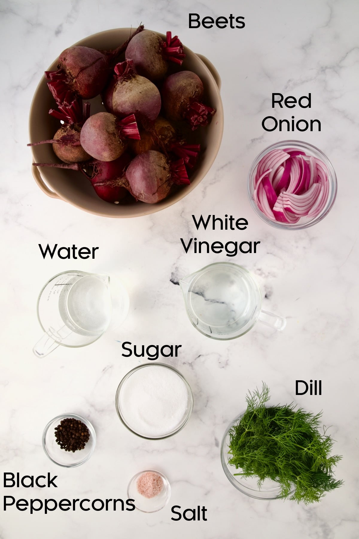 Ingredients for Refrigerator Pickled Beets in glass bowls.