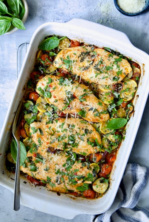 One-Pan Italian Chicken and Vegetables in white rectangular baking dish.