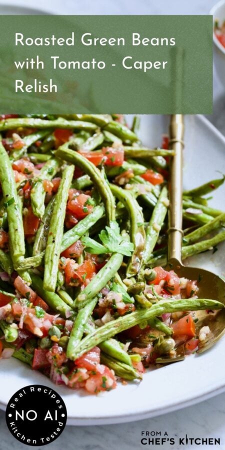 Pinterest graphic for Roasted Green Beans with Tomato - Caper Relish showing it on a white oval platter with serving utensil.
