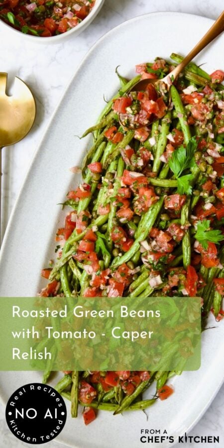 Pinterest graphic for Roasted Green Beans with Tomato - Caper Relish showing it on a white oval platter with serving utensil.