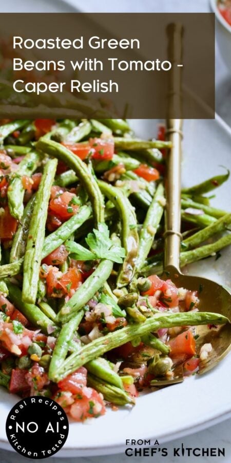 Pinterest graphic for Roasted Green Beans with Tomato - Caper Relish showing it on a white oval platter with serving utensil.