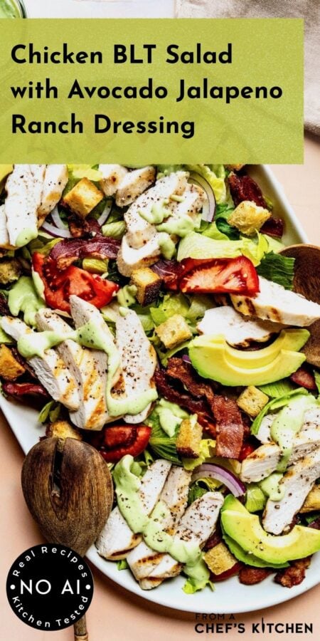 Pinterest graphic for Chicken BLT Salad showing it on a white oval platter with wooden utensils.