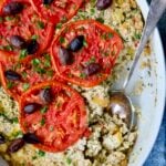 Greek Vegetable Casserole Recipe in oval baking dish with serving spoon.