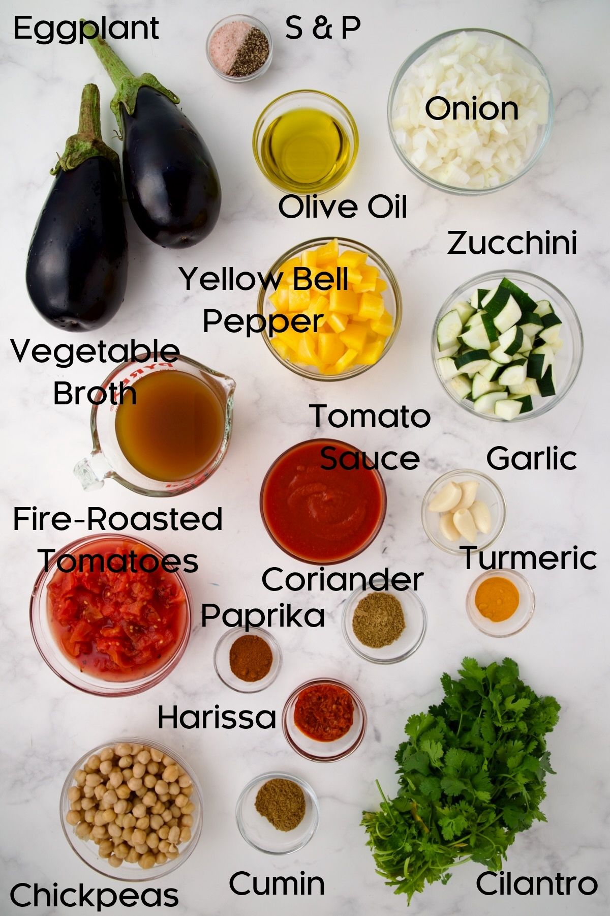 Ingredients for Moroccan Eggplant Stew in glass bowls.