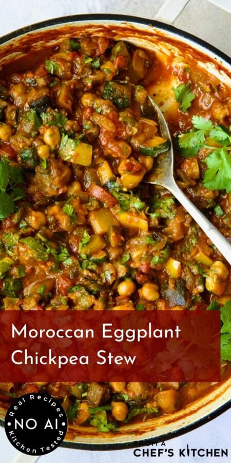 Pinterest graphic for Moroccan Eggplant Stew showing it in a white enamel cast iron skillet with serving spoon scooping some up.