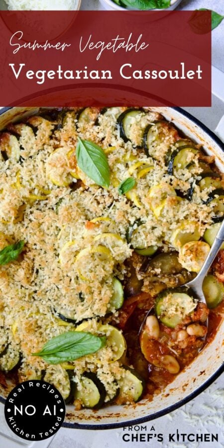 Pinterest graphic for Vegetarian Cassoulet showing it in a white enamel cast iron skillet with serving spoon.